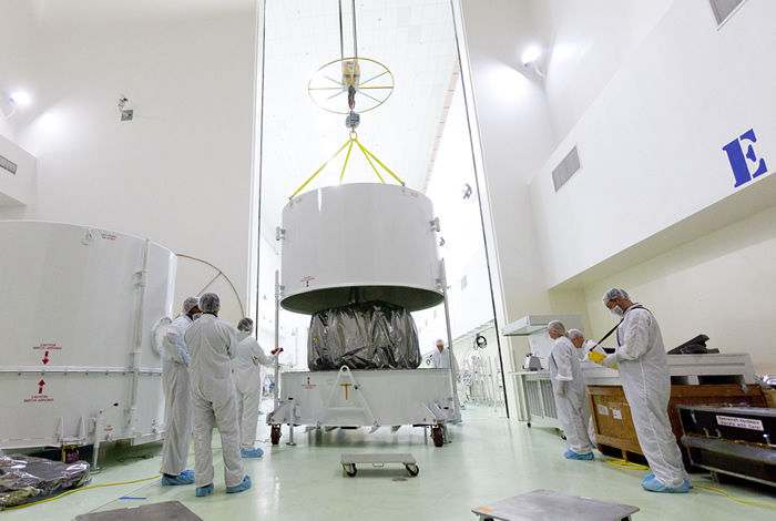 Both spacecraft shown in the bases of their individual custom-built shipping containers; 